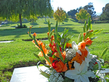 Goleta Cemetery District - Photo of flowers at a grave site.